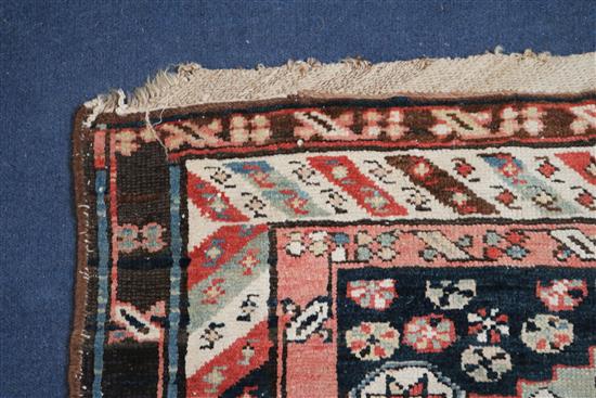 A Shirvan blue ground runner, c.1900, 15ft 6in by 3ft 7in.